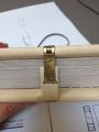 The clasp is fitted and pasted to the cover of the book.